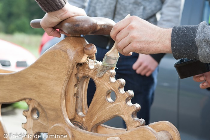 A mechanic puts some grease on the wooden bike used by former Belgian champion Eddy Planckaert to set a new world hour record on a wooden bike at the velodrome in Rochefort, Belgium on September 25, 2015.
