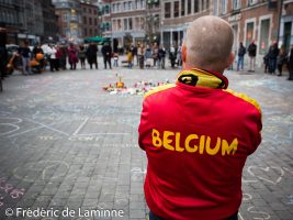 Namur, Belgium. 25 Mar, 2016. A bystander wearing a « Belgium » vest is seen during the Tribute to the victims of March 22nd terrorist attacks on Brussels in Namur, Belgium. © Frédéric de Laminne